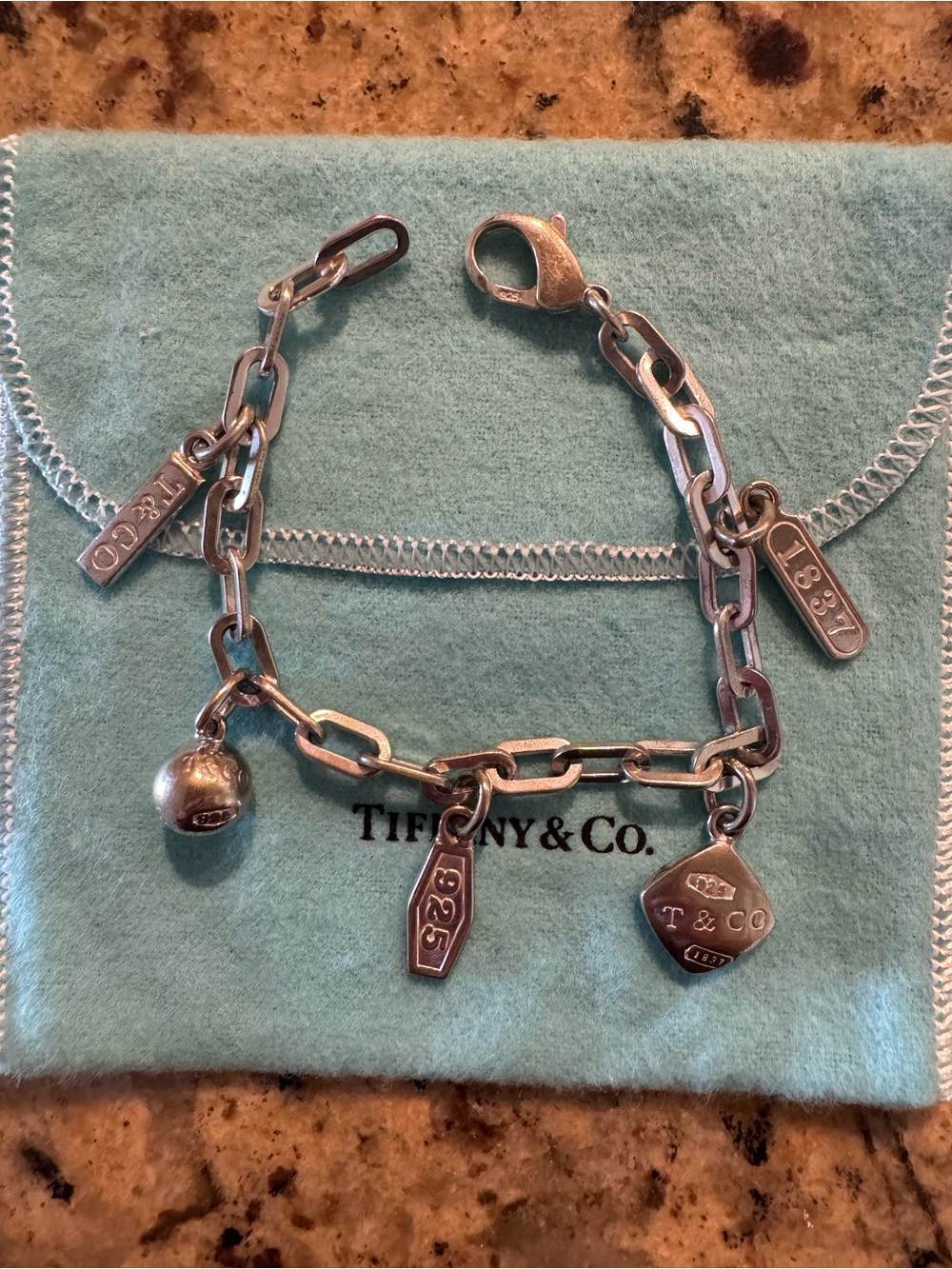 Tiffany & Co. Sterling Silver Charm Bracelet with Blue Pouch